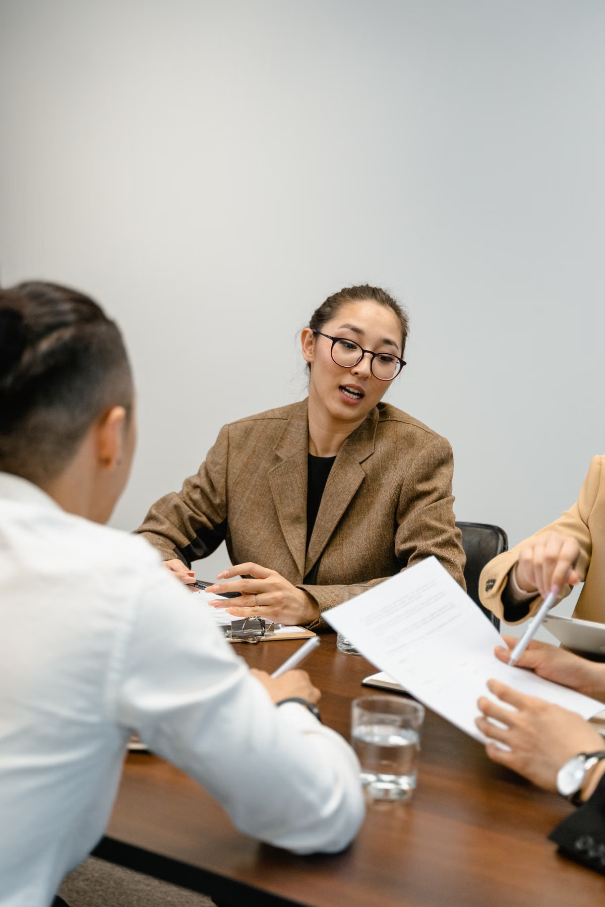 Professionals reviewing documents together in a modern office
