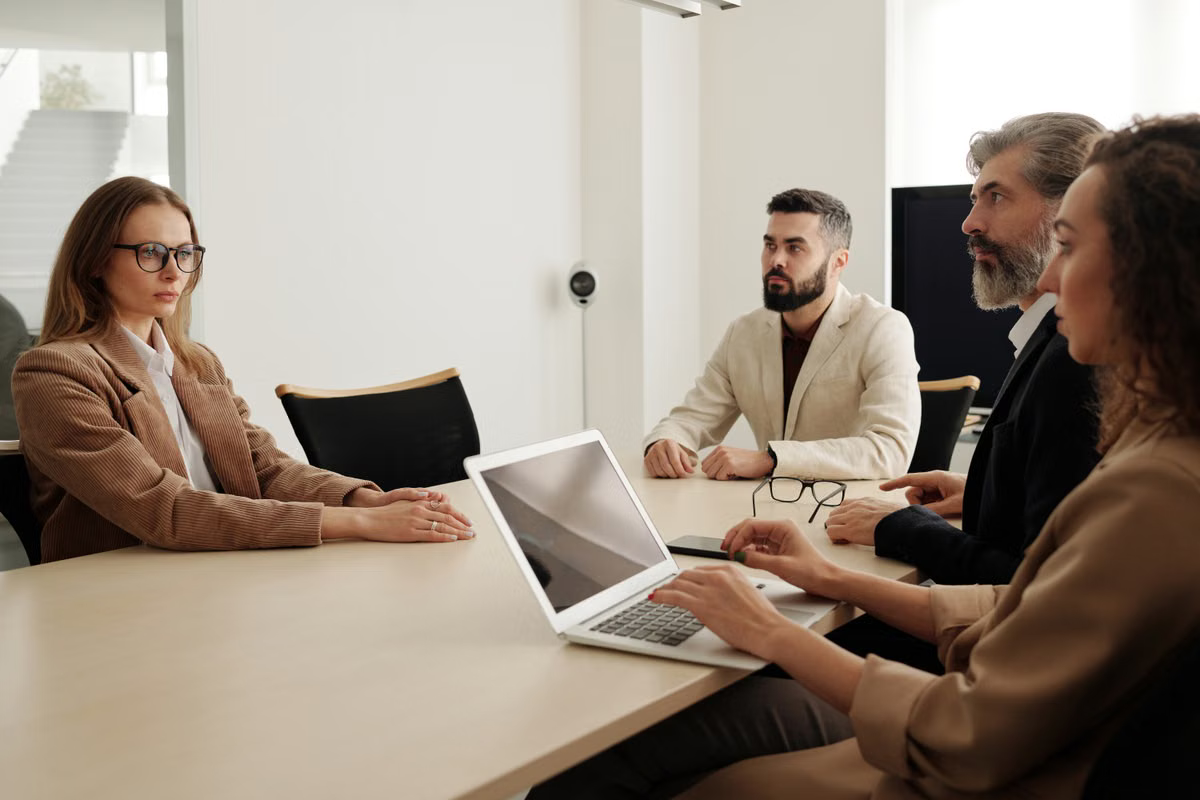 A diverse business team reviewing planning documents in a modern office