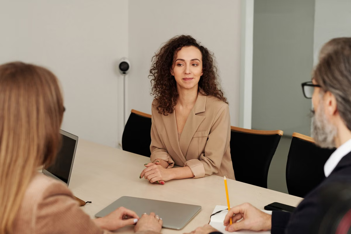 Colleagues reviewing financial projects around a conference table